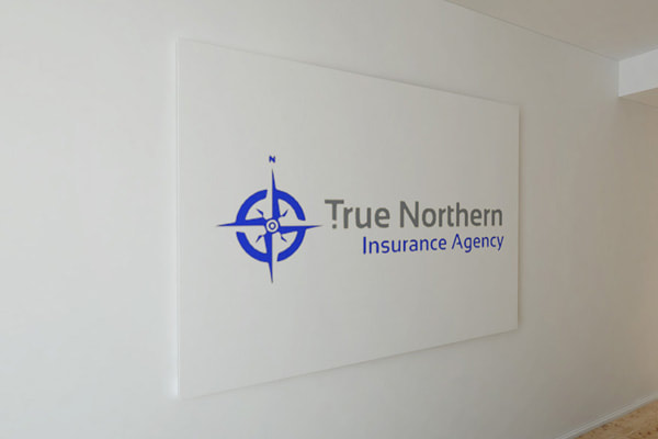 True Northern Insurance Agency logo printed on the wall